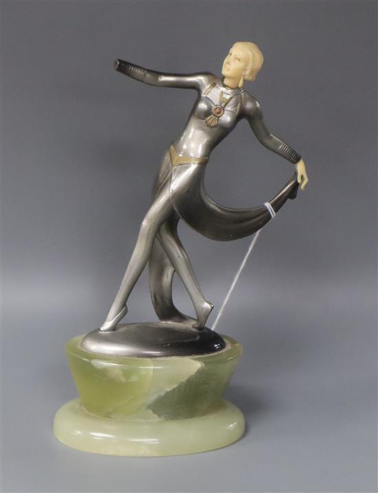An Art Deco patinated bronze and ivory figure of a dancer by Lorenzl, right hand missing